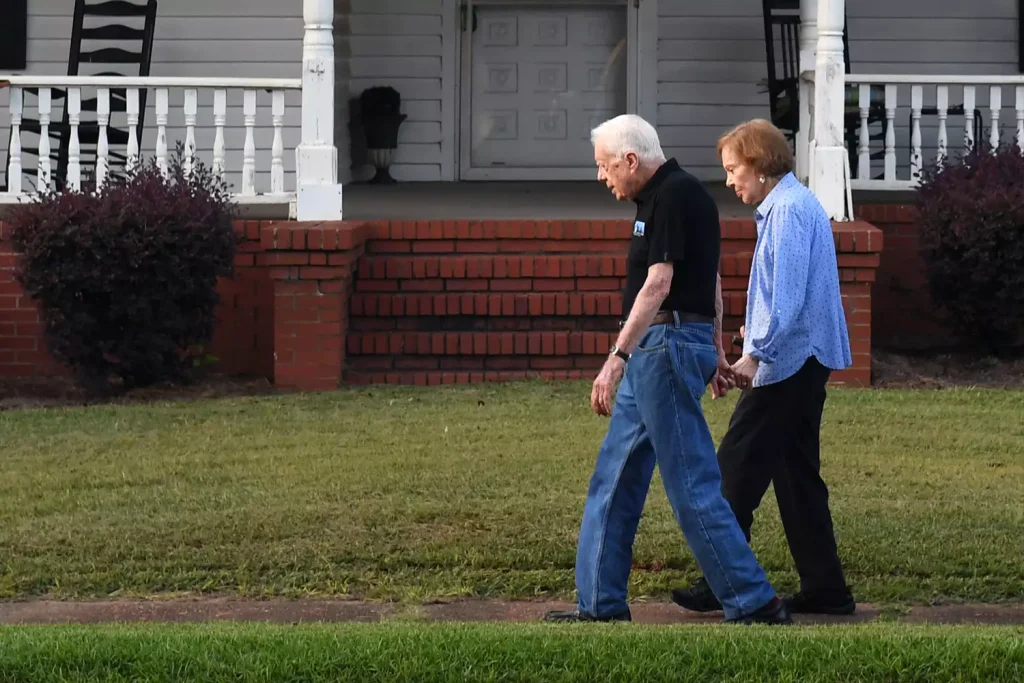 Former U.S. President Jimmy Carter and his wife former First Lady Rosalynn Carter sit together during a reception to celebrate their 75th wedding anniversary on July 10, 2021, in Plains, Ga