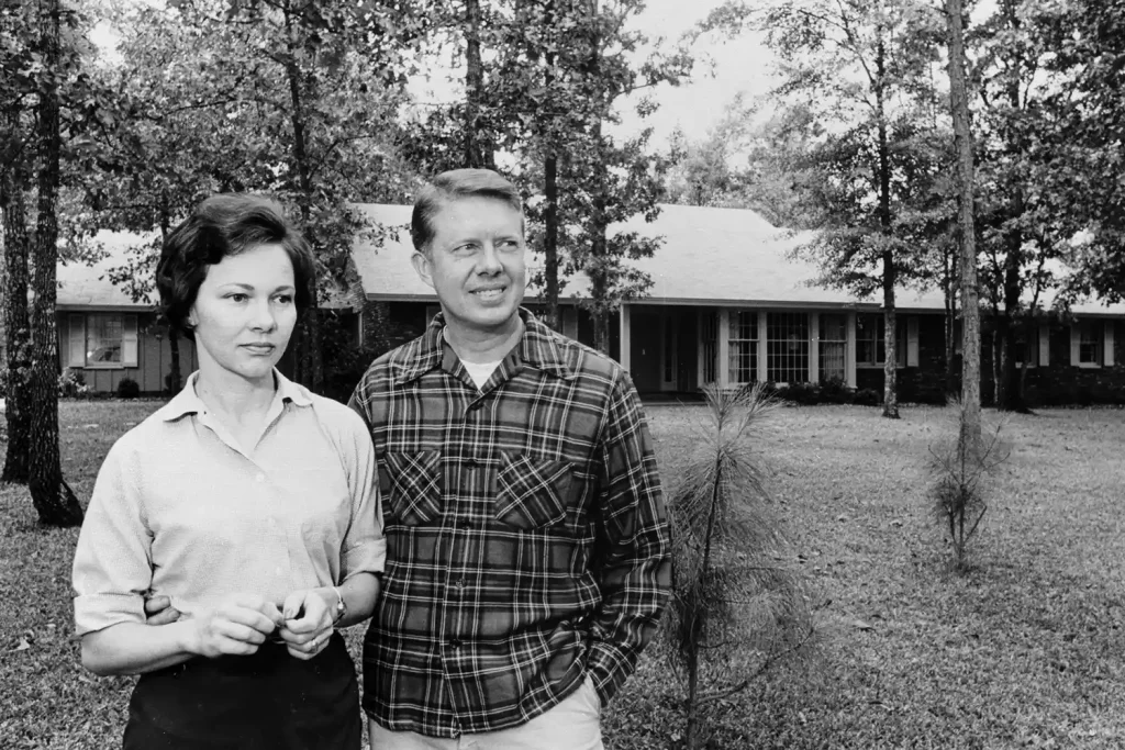 Rosalynn and Jimmy Carter in front of their Plains, Georgia, home in 1965. JIMMY CARTER LIBRARY