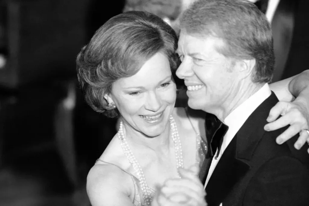 President Jimmy Carter and his wife, Rosalynn, dance at the annual Congressional Christmas Ball at the White House on Dec. 13, 1978.Ira Schwarz / AP file