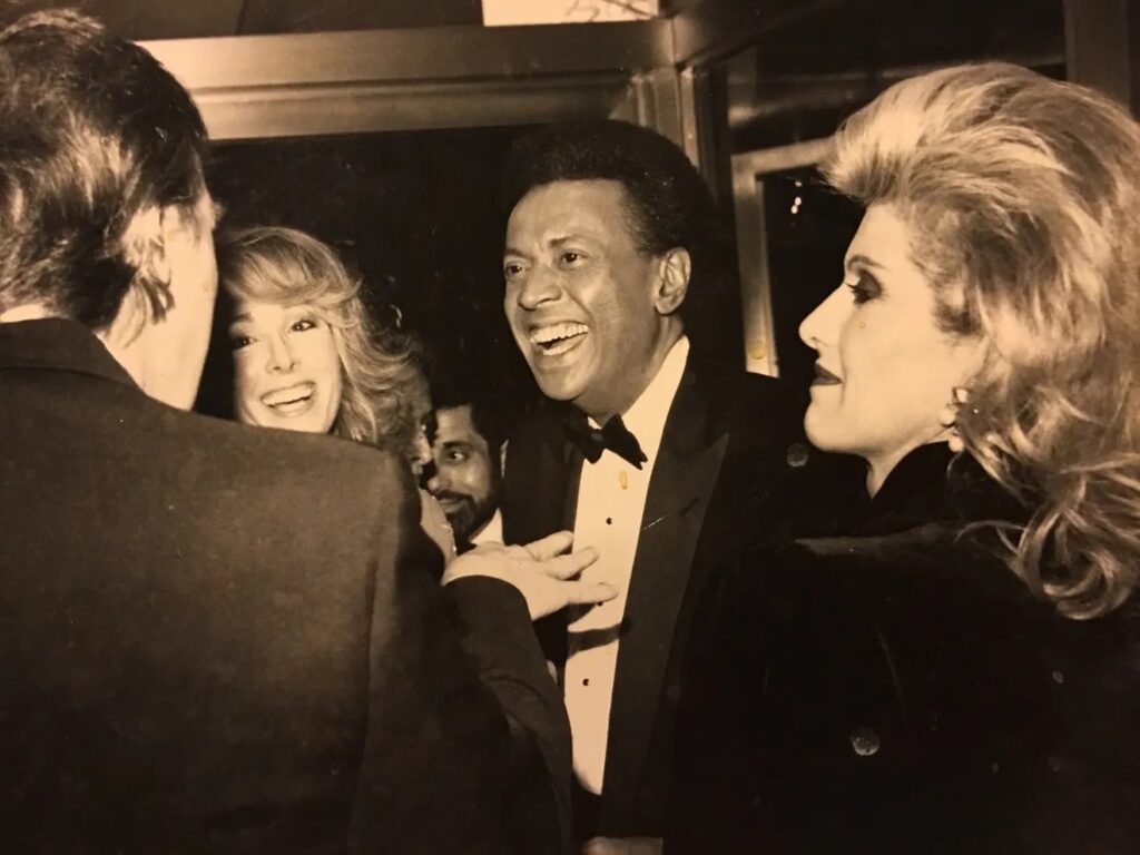 Donald Trump (left) and E. Jean Carroll (second from left, with then-husband John Johnson) in a photograph Carroll says dates from a 1987 party they attended - Photo Courtesy Of E. Jean Carroll/St. Martin's Press